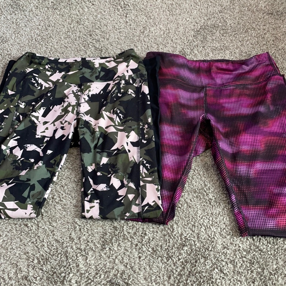 Two pairs of fitness leggings, size Medium.